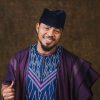 Filmmaker Ramsey Nouah unveiled a first-look teaser for the Play Network Studios And Ramsey Films’ biopic of 90s robbery kingpin Shina Rambo.